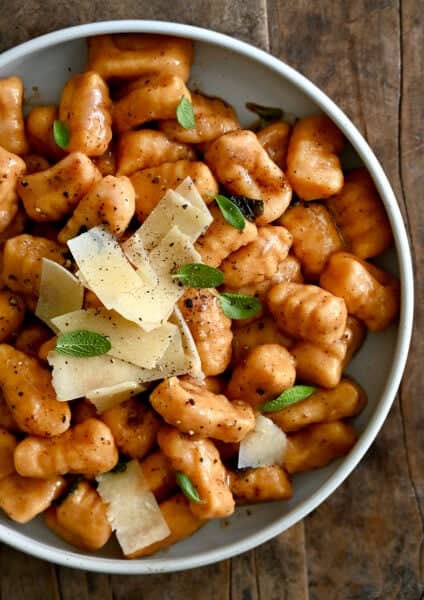 Homemade sweet potato gnocchi tossed in a brown butter sage and topped with crispy sage leaves and parmesan shavings.